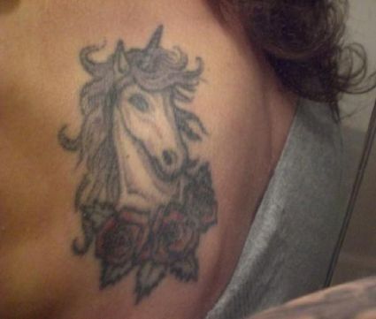 Unicorn Head Tattoo On Left Shoulder Blade