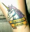 unicorn head tattoo on leg