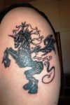 unicorn pic tattoo on arm