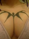 bat tattoo on breast