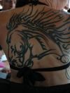 tribal horse head back tattoo