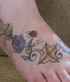 ladybug and flower tattoo on feet