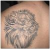 lion head tattoo image on left shoulder blade