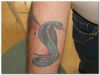 snake tattoo on hand