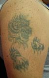 tiger head and claw tattoo