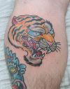 tiger head tattoo on calf