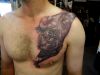 tiger tattoo on chest of man