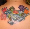 little turtle and hibiscus tattoo