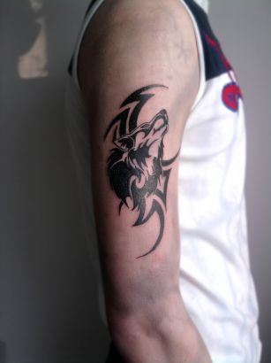 Tribal Wolf Head Tattoo On Right Arm