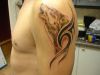 wolf head tribal tattoo on left arm