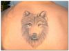 wolf face tat on back