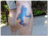 blue frog tattoo on calf