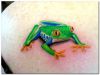 frog tattoo on left shoulder