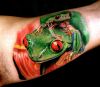 frogs tattoo on inside of arm