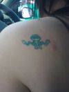 frog image tattoo on shoulder