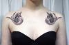 bird girl's chest tattoo