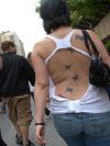 butterflies pic tattoo on back of women