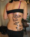 butterflies pic tattoos on back of women