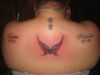 butterfly and text pic tattoo on back