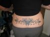 tribal butterfly image tattoo on lower back