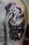 eagle and skull tattoo on left arm