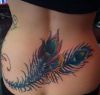 peacock feather tattoos on lower back