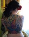 peacock tattoo pics on back of girl