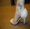 dove pic tattoo on ankle
