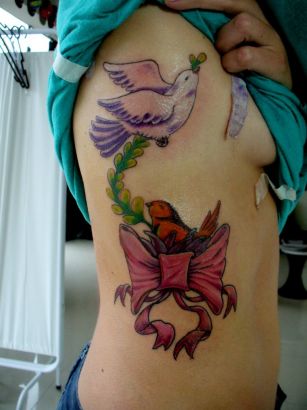 Loving Bird Tattoo On Rib