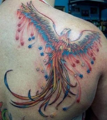 Phoenix And Small Stars Pic Tattoo On Back