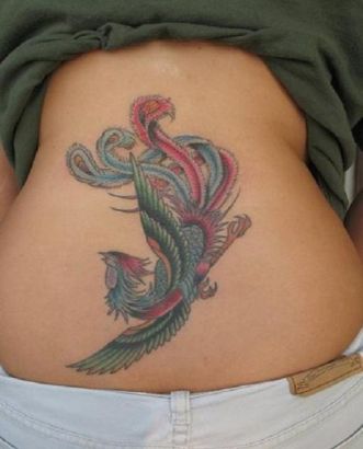 Phoenix Pic Tattoo On Back Of Girl