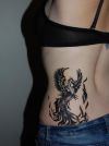 phoenix image tattoo on side back