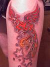 phoenix images tattoo on thigh