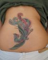 phoenix pic tattoo on back of girl