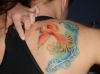 phoenix pic tattoo on right shoulder blade