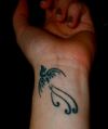 tribal phoenix picture tattoo on wrist