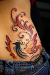 phoenix girl's lower back tattoo