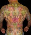 man with full back asian tattoo