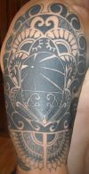 polynesian tattoo on right arm