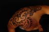 polynesian tattoo on shoulder