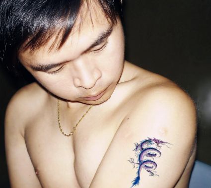 Small Dragon Pic Tattoo On Arm