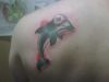 Dolphin tattoo design on back