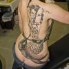 mermaid and snake tattoo on back