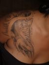a girl with shark tattoo