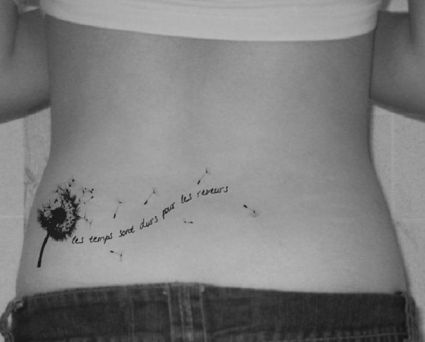 Dandelion Flower And Text Tattoo On Lower Back