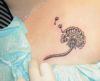 dandelion flower tattoo on chest of girl