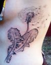 dandelion flower tattoo on rib