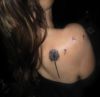 dandelion flower tattoo on right shoulder blade