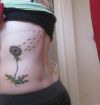 dandelion flower tattoo on side back