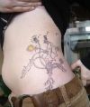 dandelion flower tattoo on side stomach